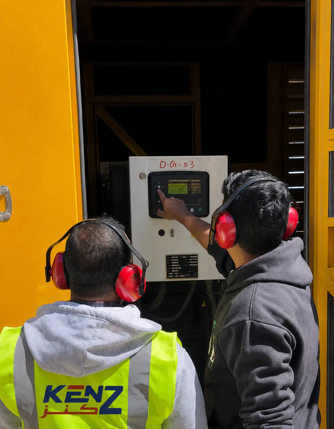 Kenz Electric engineers testing power generator control interface at NC2 Base Camp work in NEOM