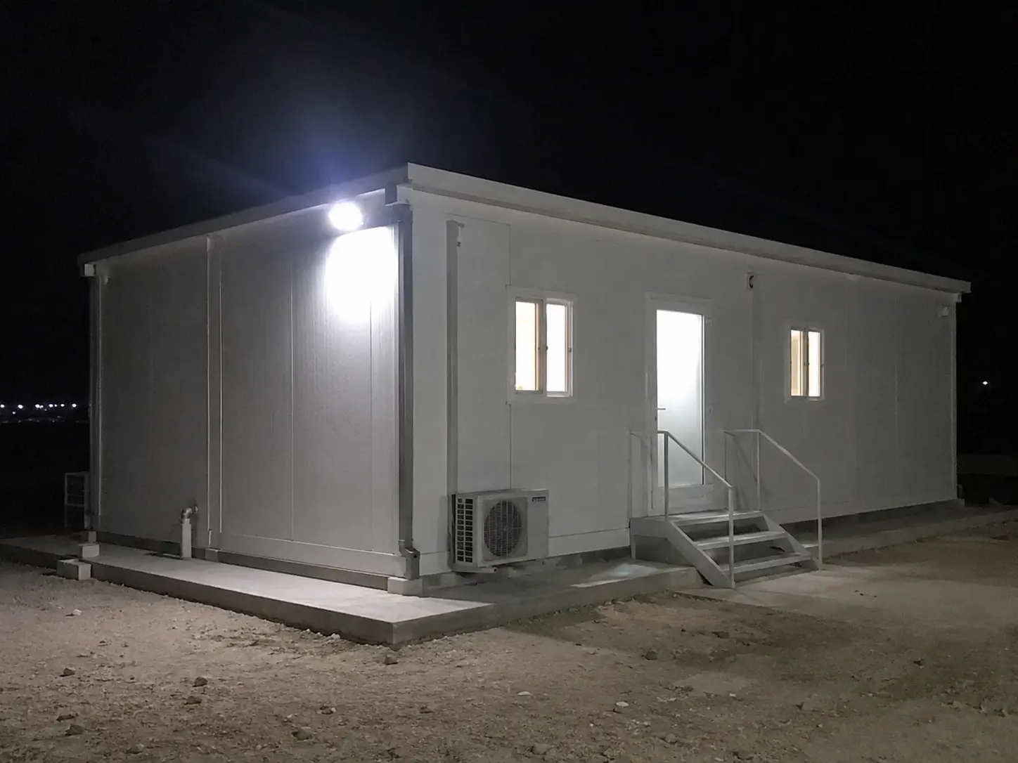 Kenz welder fabricating heavy steel chassis for modular container