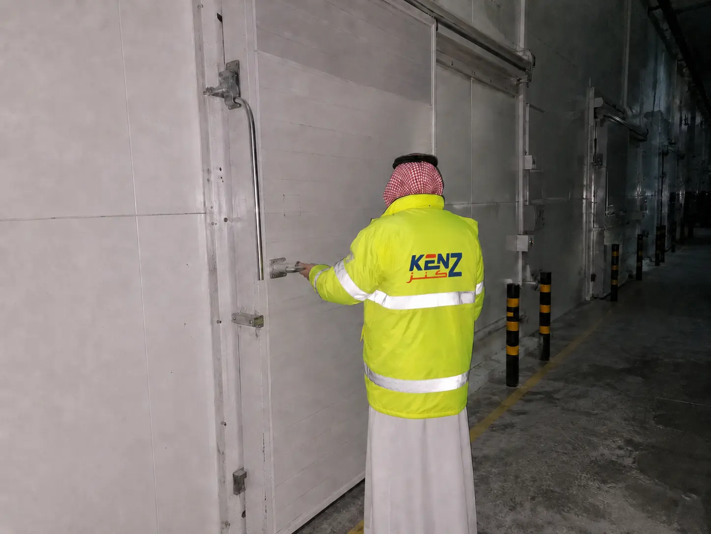 Field Maintenance: Kenz Cold technician performing field maintenance on industrial refrigeration door systems