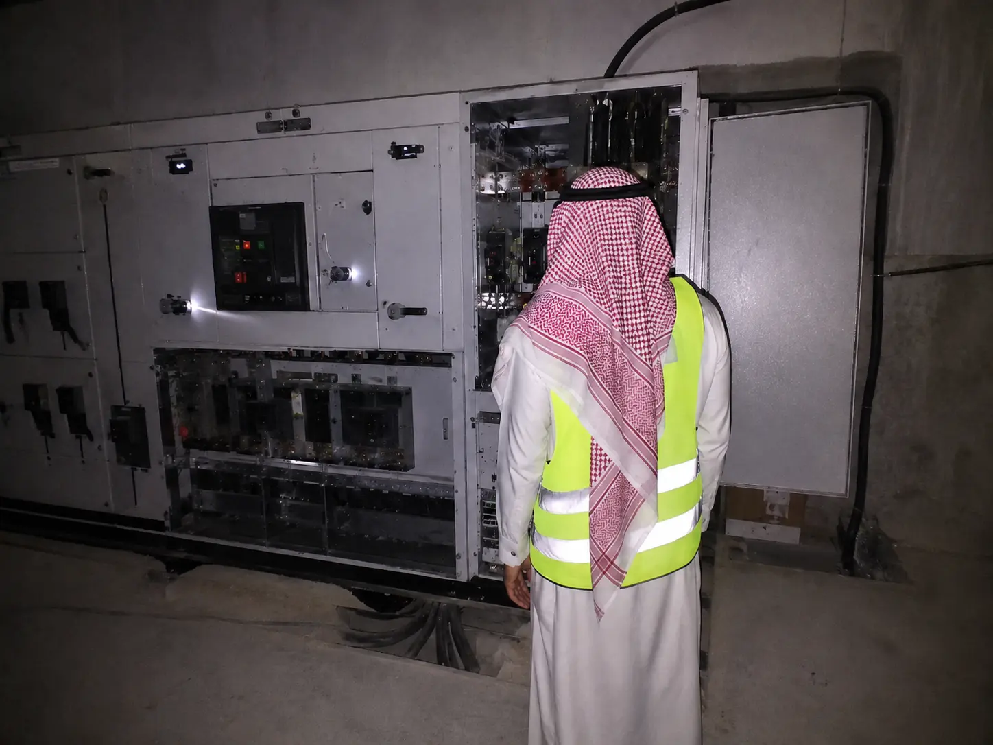 Electrical Engineer operating modern SCADA automation system interface