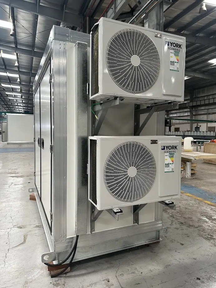 Exterior York HVAC units mounted on Kenz communication shelter