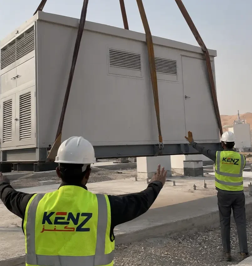 Heavy crane deployment of Kenz prefabricated equipment shelter